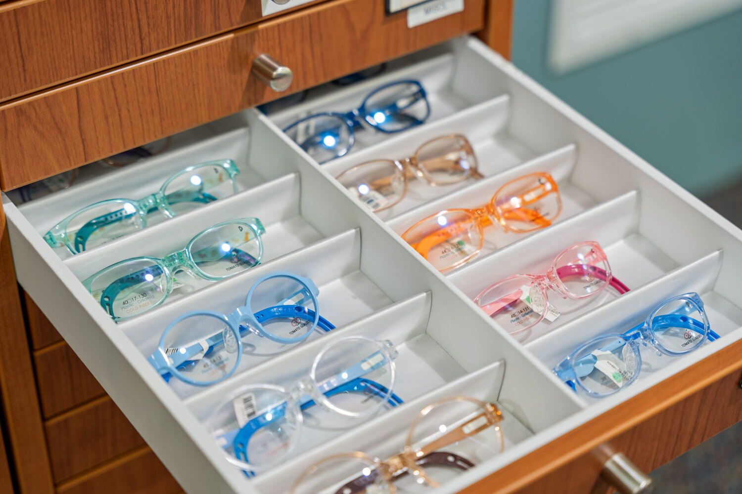 A drawer of colorful children's frames at MacPherson Opticians.